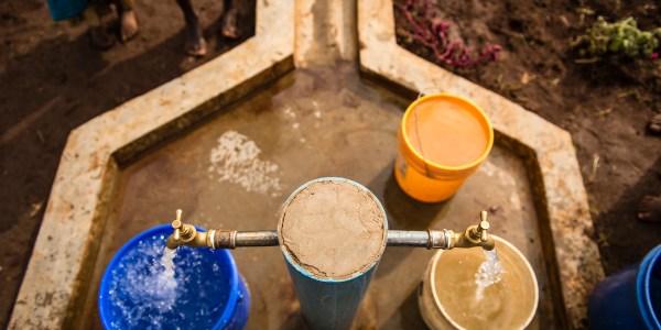 Safe water flows from a tap in Mlondwe, Tanzania.