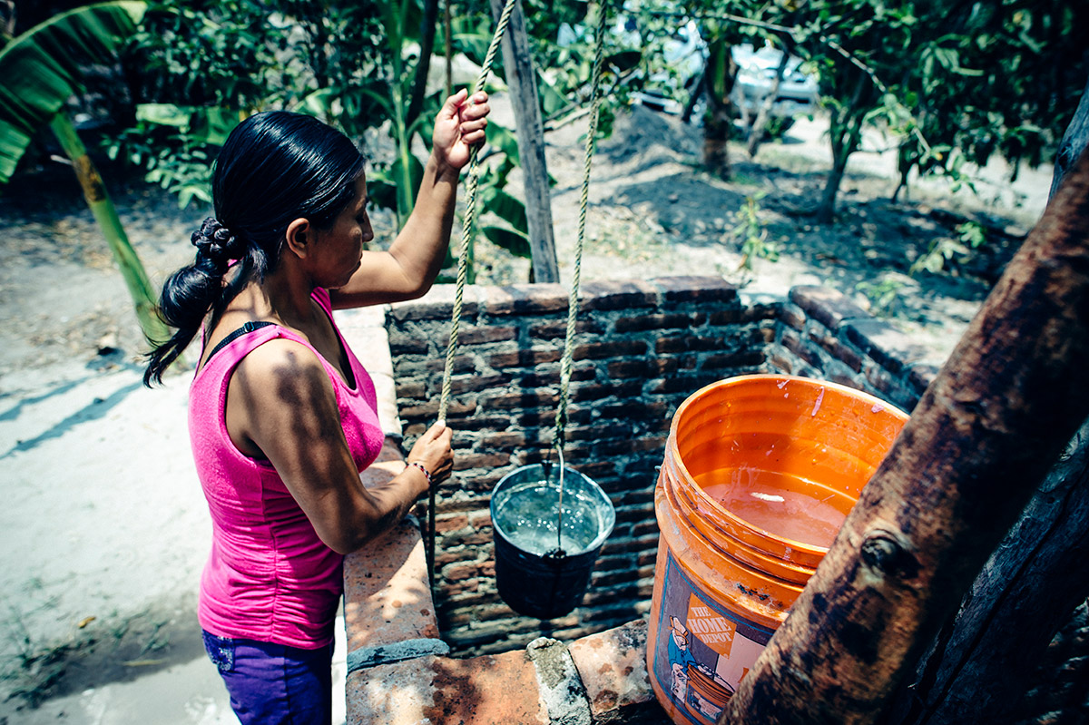 Hortencia draws water for her family