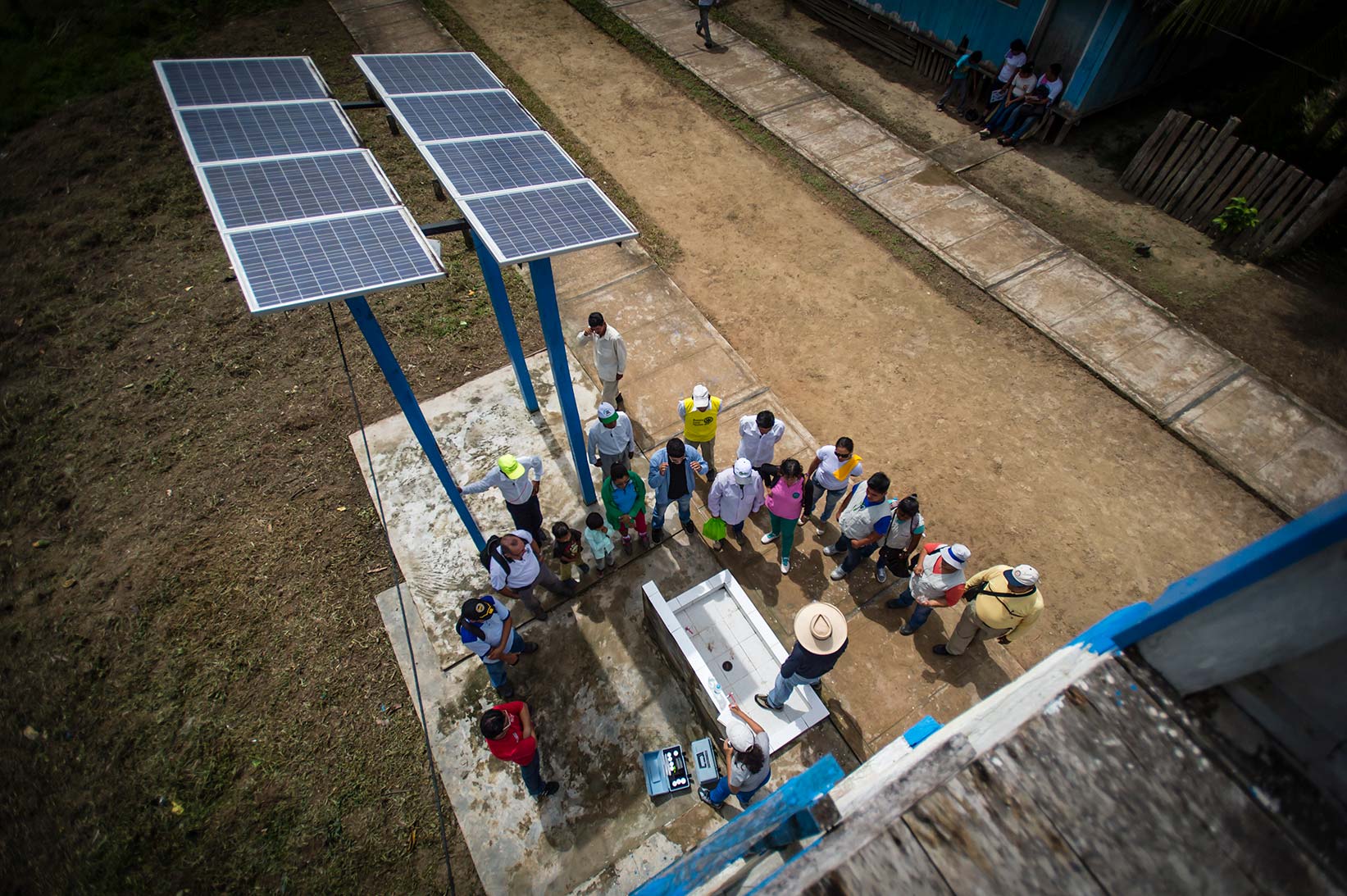 Solar panels power the safe water treatment system for Segundo and his family.