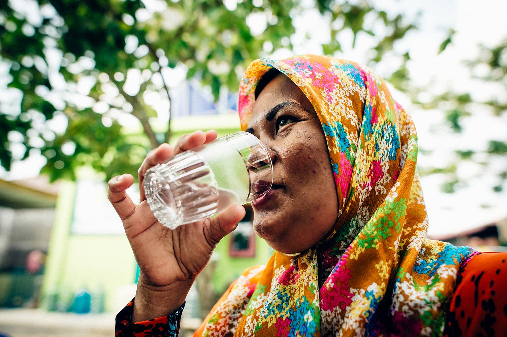 Hayani drinks safe water at her home in Indonesia.